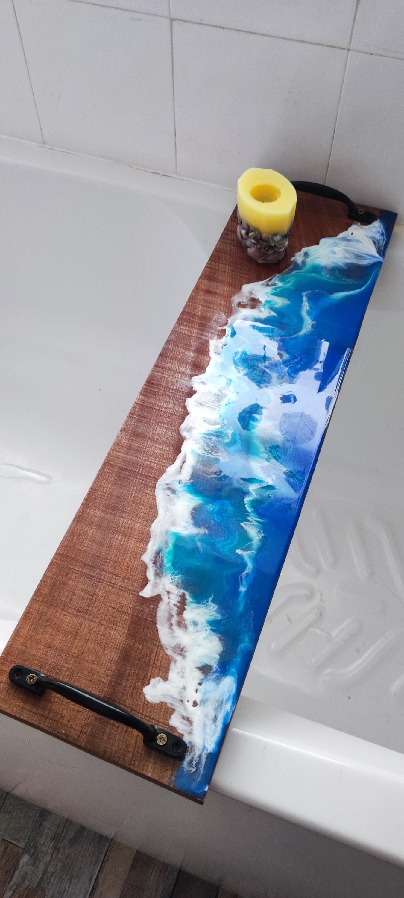Sapele wood bath tray with resin ocean waves