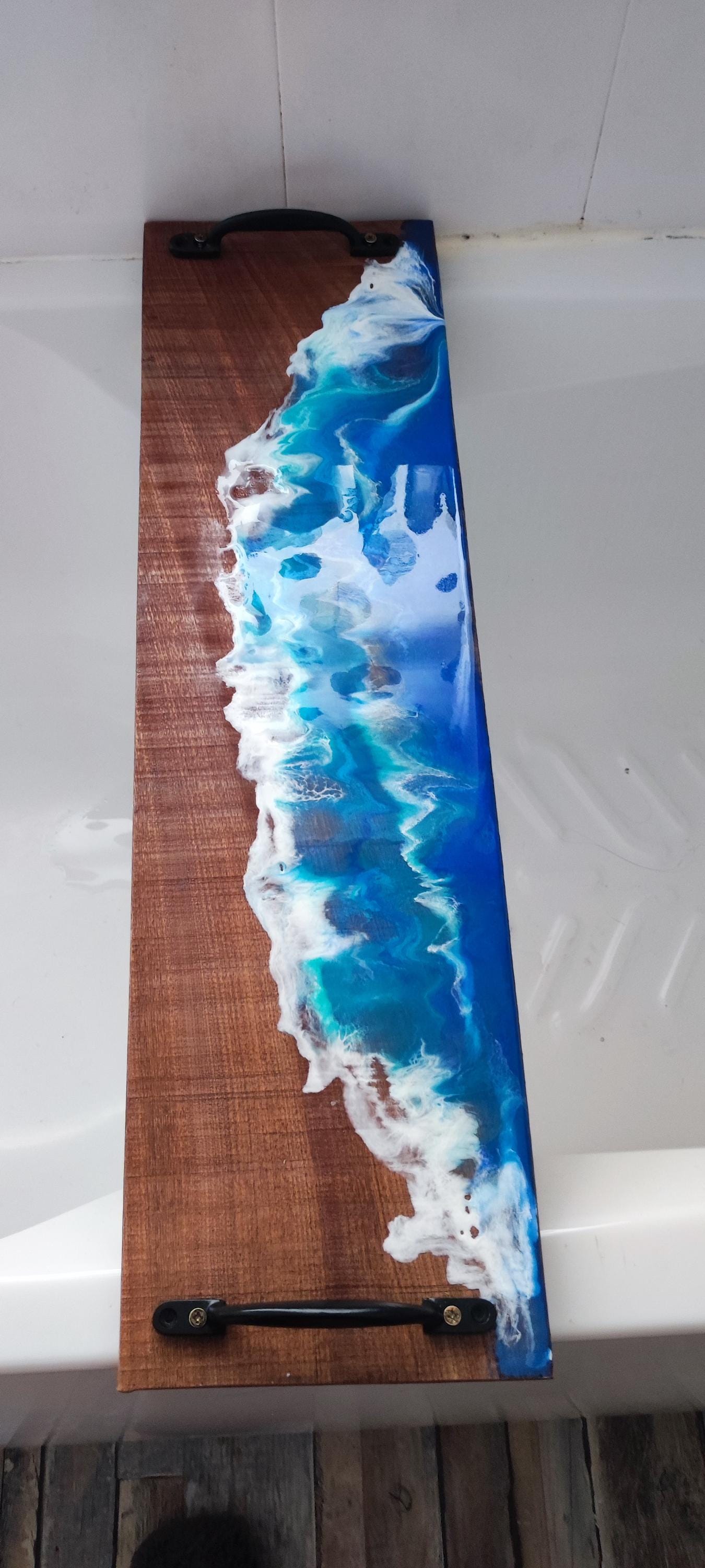 Sapele wood bath tray with resin ocean waves