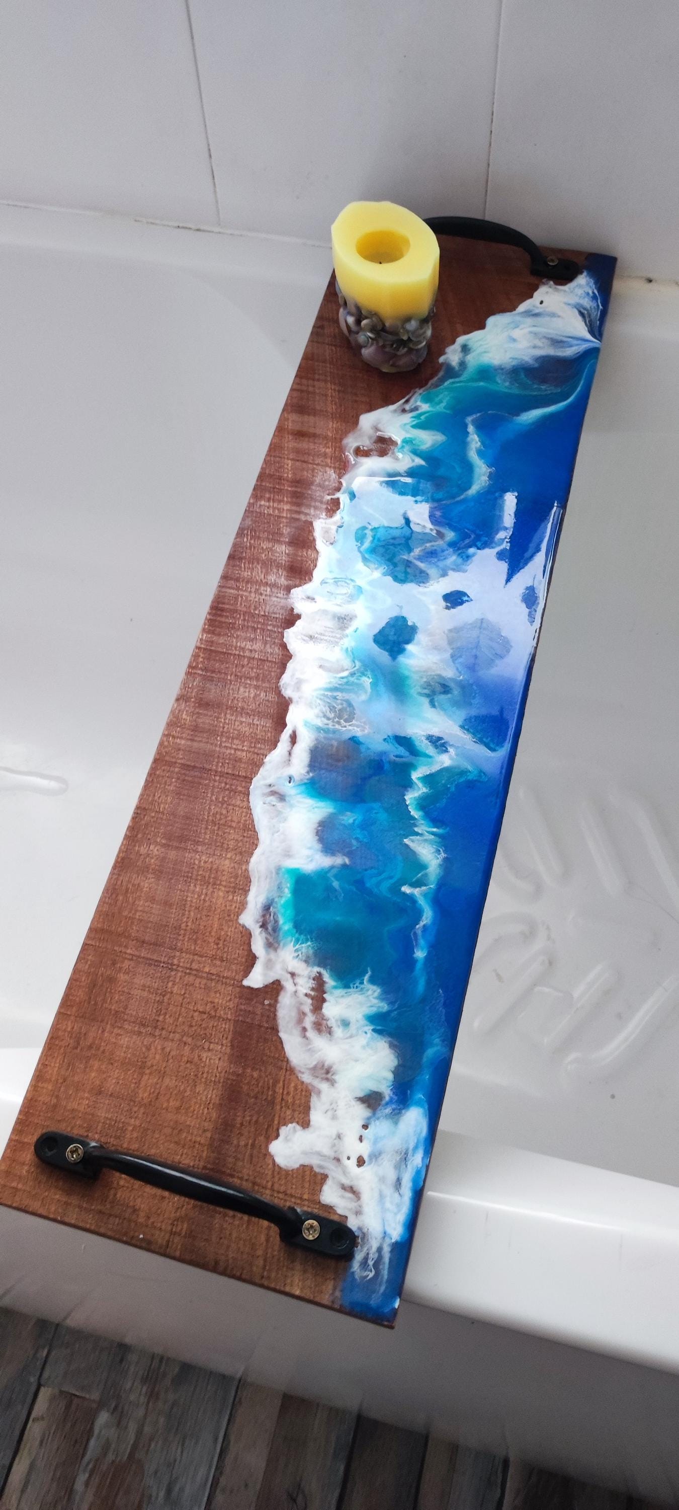 Sapele wood bath tray with resin ocean waves