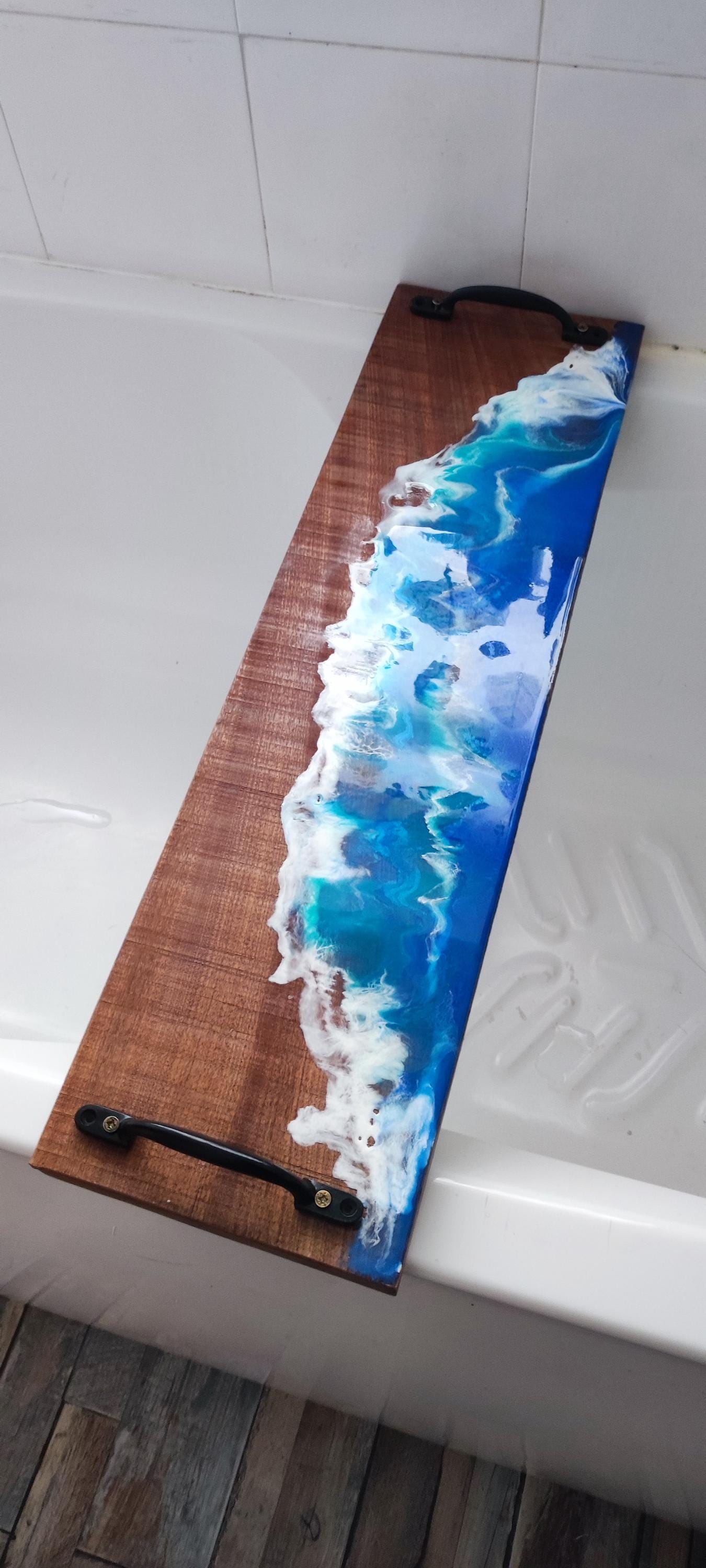 Sapele wood bath tray with resin ocean waves